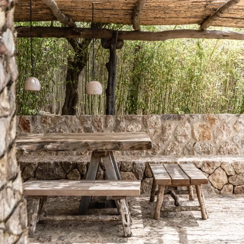 Outdoor dinning, wooden table under a roof