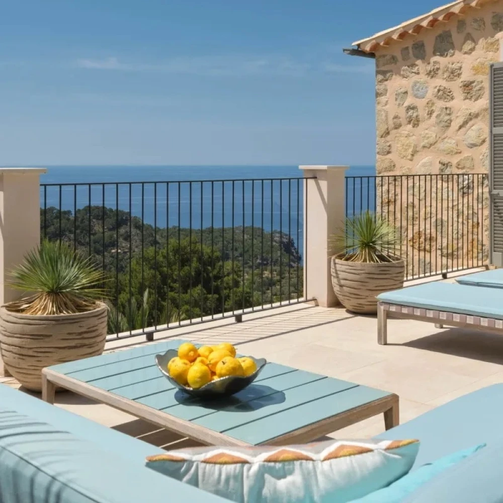 Outdoor seating area, table with a bowl of lemons