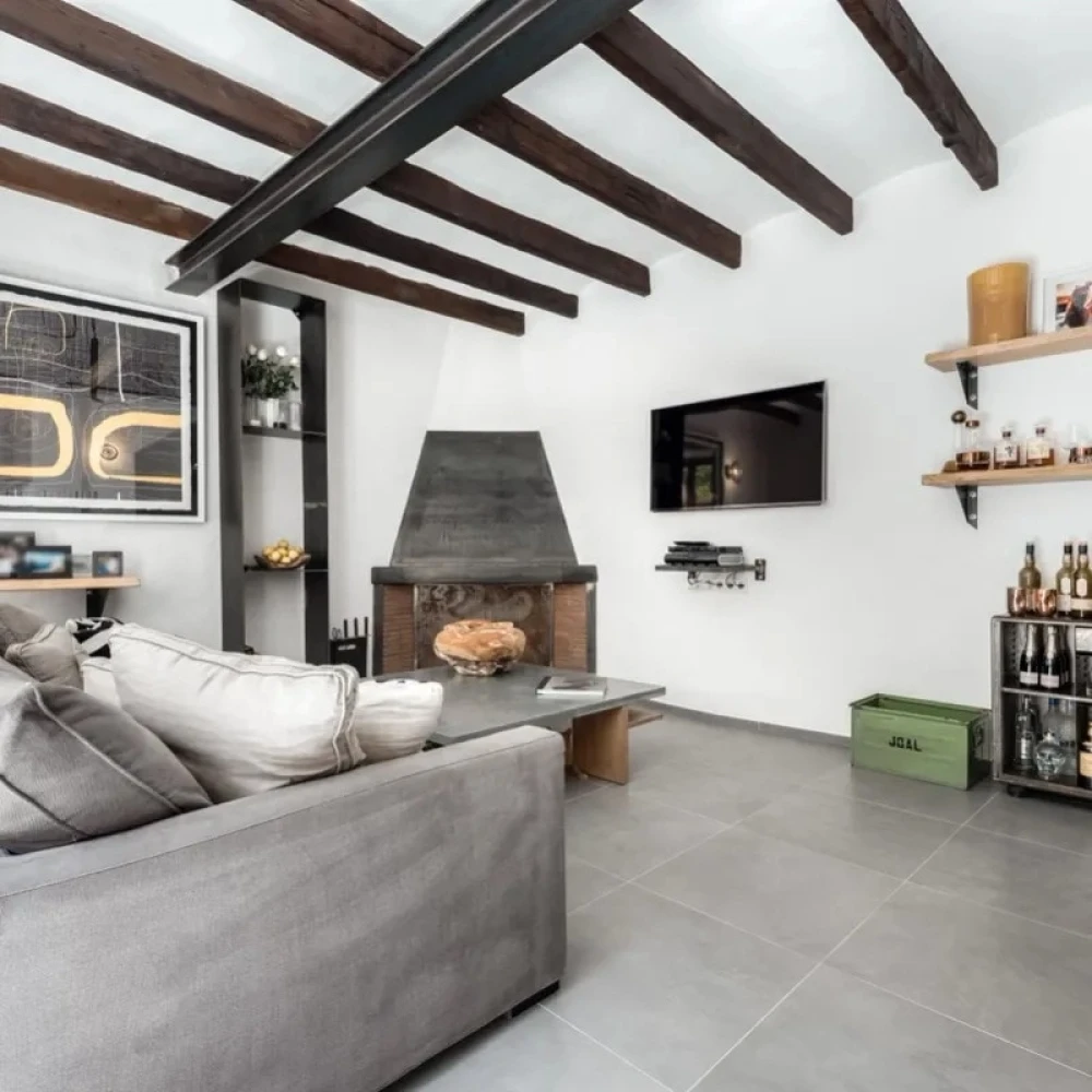 Room with beams on ceiling inside a Mallorca villa