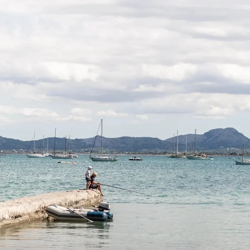 Two people fishing in the sea